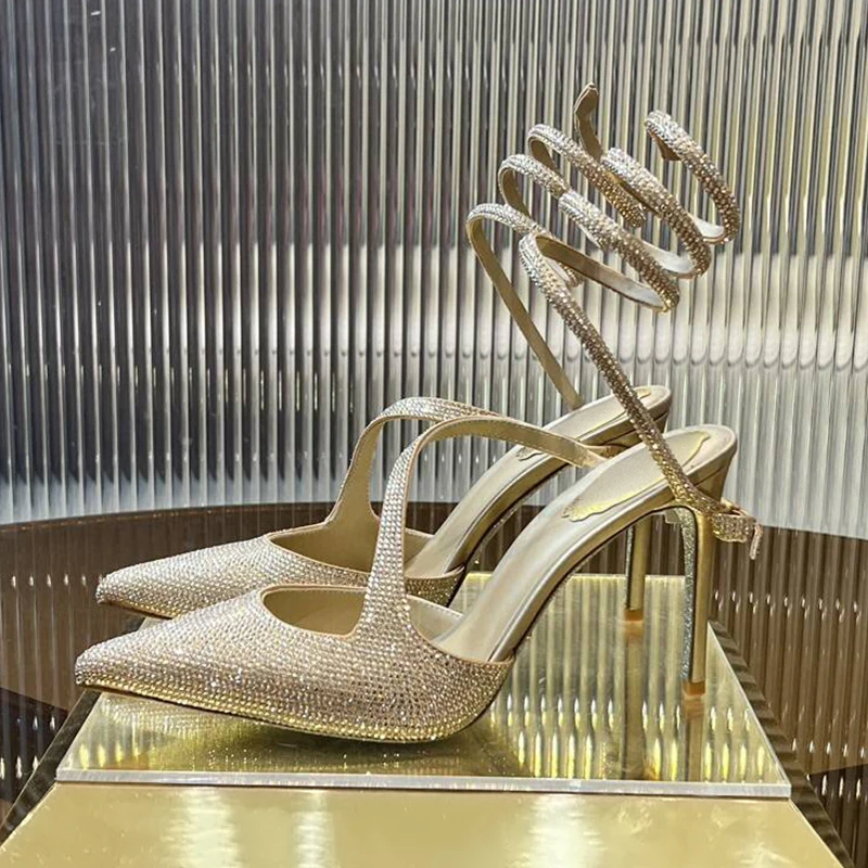 Модельные туфли, сандалии в форме змеи с острым носком и эластичным ремешком, женские сандалии со стразами на тонком каблуке, летние свадебные туфли
Модельные туфли, сандалии в форме змеи с острым носком и эластичным ремешком, женские сандалии со стразами на тонком каблуке, летние свадебные туфли
