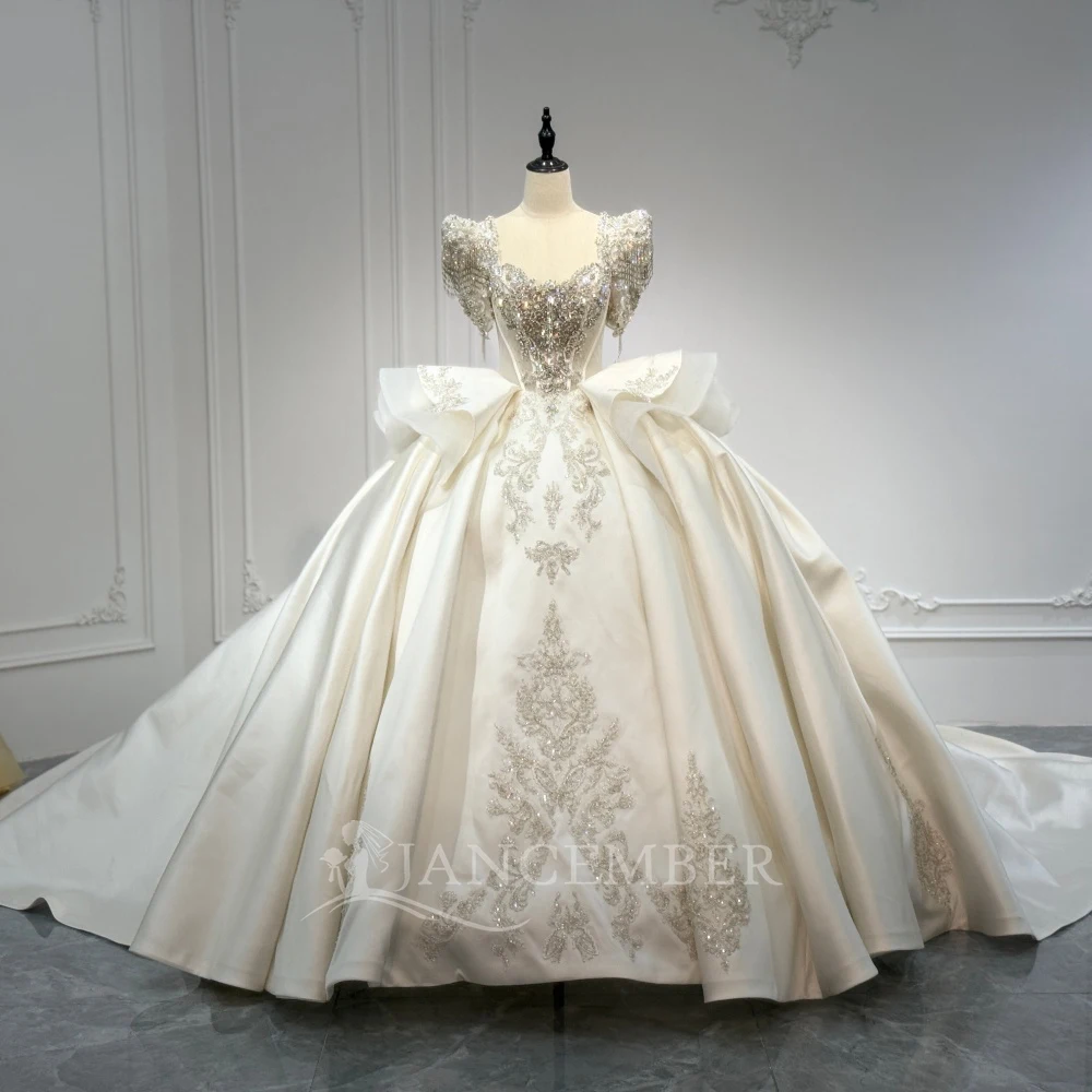 Luxurious Sparkling Ball Gown Lace Beaded Wedding Dress With Transparent Short Sleeve Bridal Ball Dress Customized robe de marié
Luxurious Sparkling Ball Gown Lace Beaded Wedding Dress With Transparent Short Sleeve Bridal Ball Dress Customized robe de marié