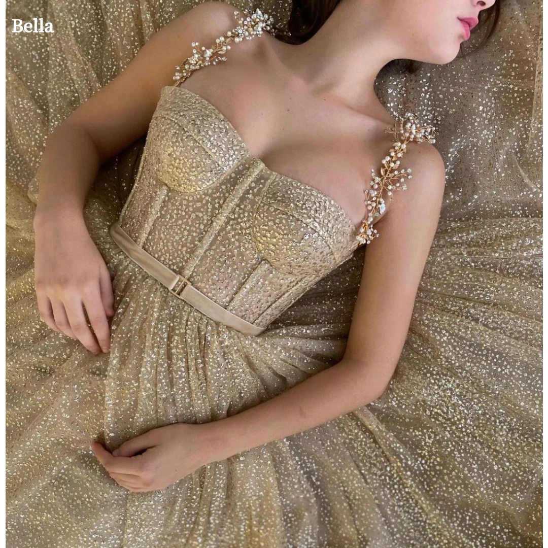 Bella Индивидуальные жемчужные бретельки с блестками, вечерние платья, золотые вечерние платья трапециевидной формы без бретелек, платье для выпускного вечера длиной до щиколотки
Bella Индивидуальные жемчужные бретельки с блестками, вечерние платья, золотые вечерние платья трапециевидной формы без бретелек, платье для выпускного вечера длиной до щиколотки