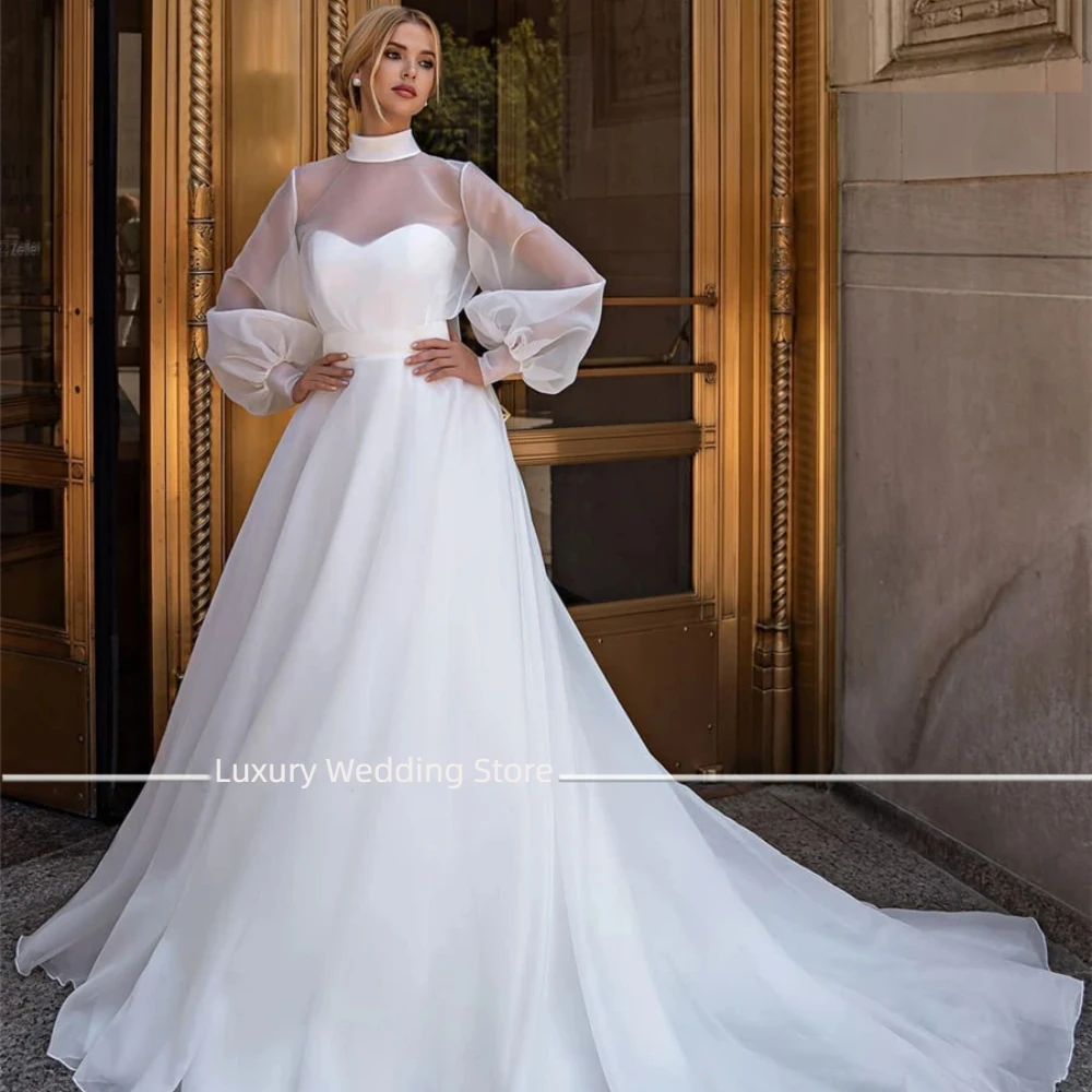 Luxury New High Neck See Through Organza Hot Sale Wedding Dress with Bow Dress for Bridal Gowns Long Sleeves Vestidos Para Mujer
Luxury New High Neck See Through Organza Hot Sale Wedding Dress with Bow Dress for Bridal Gowns Long Sleeves Vestidos Para Mujer