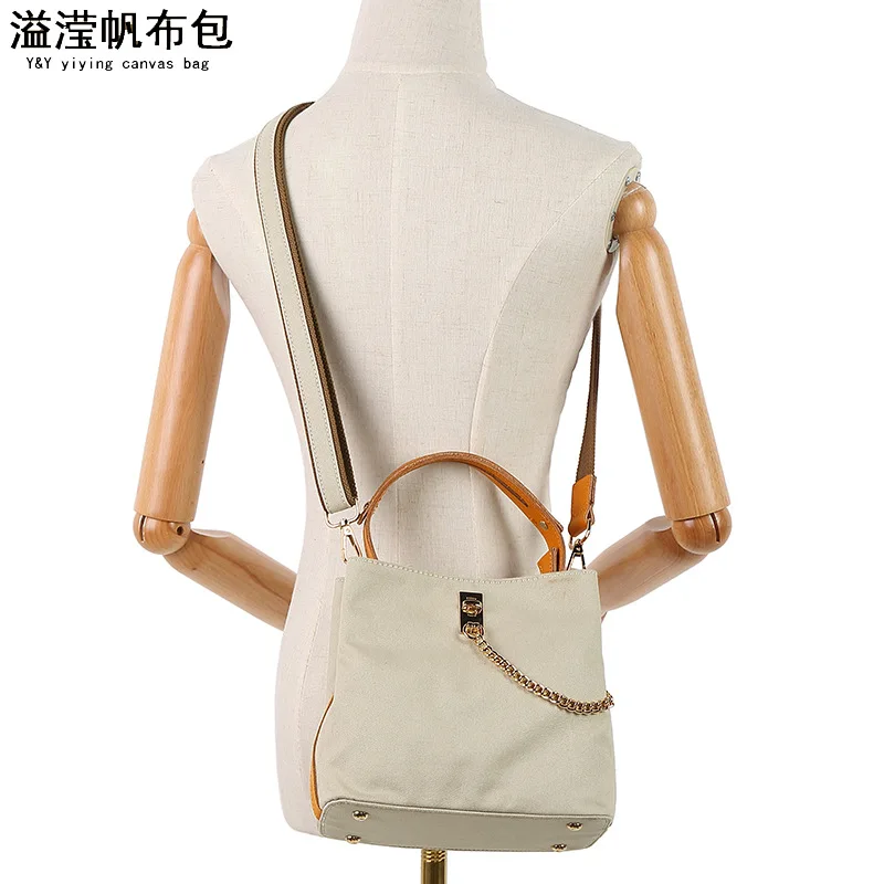 Casual women's portable waterproof canvas oblique span bag, with first-layer leather solid color shoulder bag, fashionable, simp
Casual women's portable waterproof canvas oblique span bag, with first-layer leather solid color shoulder bag, fashionable, simp
