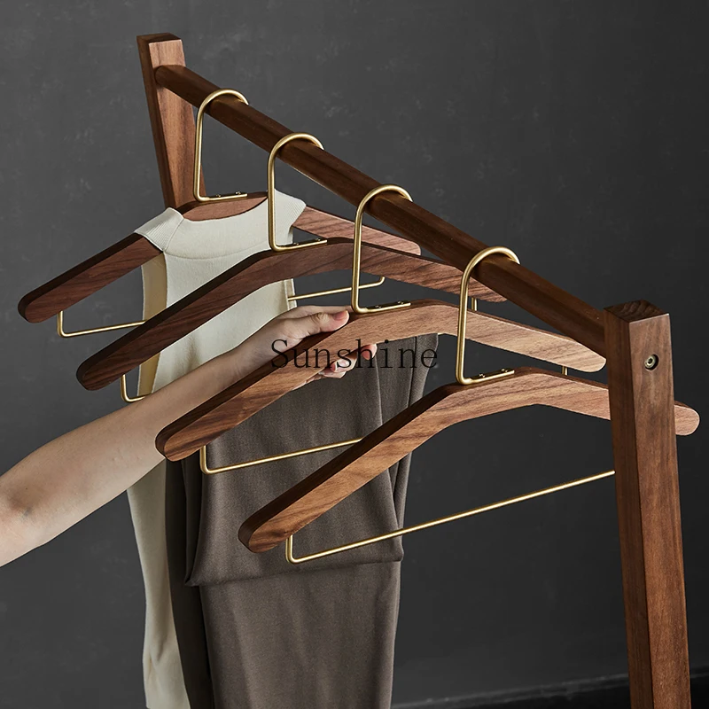 Black walnut solid wood hanger non-slip and non-marking clothes support brass hook household
Black walnut solid wood hanger non-slip and non-marking clothes support brass hook household