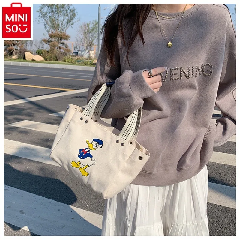 MINISO Disney Cartoon Donald Duck Casual Fashion Trend Women's Crossbody Bag Sweet Canvas Shoulder Bag
MINISO Disney Cartoon Donald Duck Casual Fashion Trend Women's Crossbody Bag Sweet Canvas Shoulder Bag