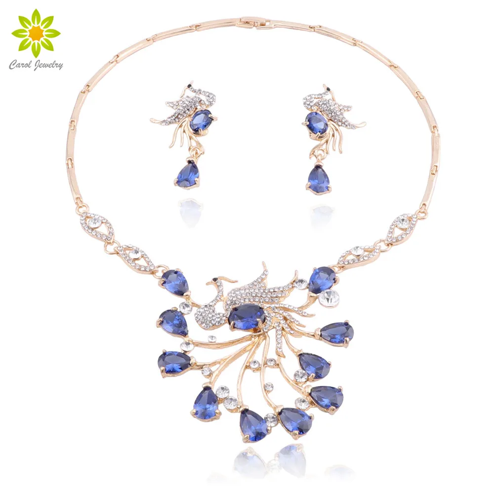 Африканские свадебные комплекты ювелирных изделий в стиле птицы Феникса, ожерелье и серьги с синими кристаллами, женские аксессуары для выпускного вечера
Африканские свадебные комплекты ювелирных изделий в стиле птицы Феникса, ожерелье и серьги с синими кристаллами, женские аксессуары для выпускного вечера