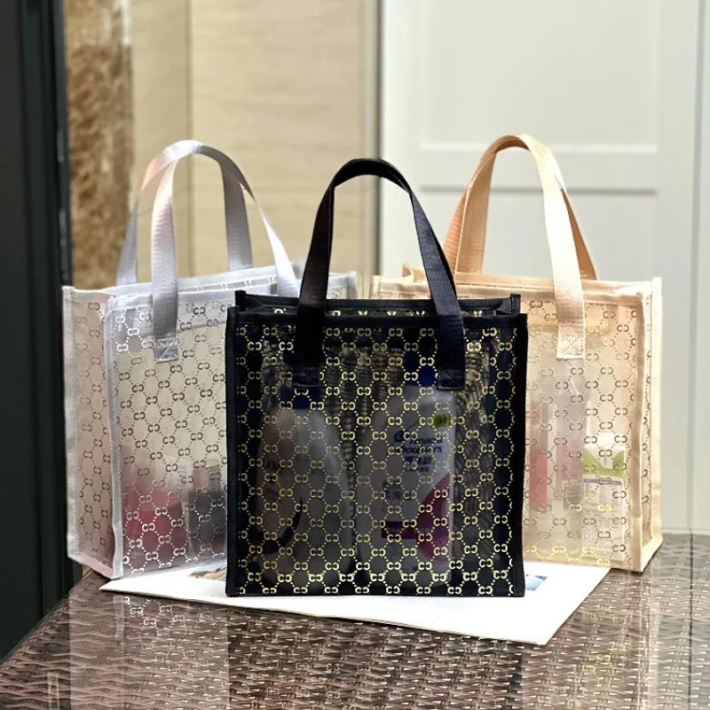New Korean-style Gold-embossed Transparent Mesh Handbag: Make-up and Toiletries Bag, Work Bag, Commuter Bag, Snack Bag Mum Bag
New Korean-style Gold-embossed Transparent Mesh Handbag: Make-up and Toiletries Bag, Work Bag, Commuter Bag, Snack Bag Mum Bag