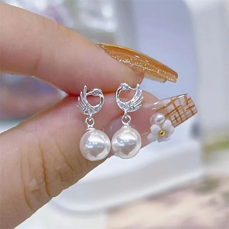 990 pure silver Korean version pearl earrings for women, light luxury, high-end, stylish, versatile, and niche style earrings
990 pure silver Korean version pearl earrings for women, light luxury, high-end, stylish, versatile, and niche style earrings