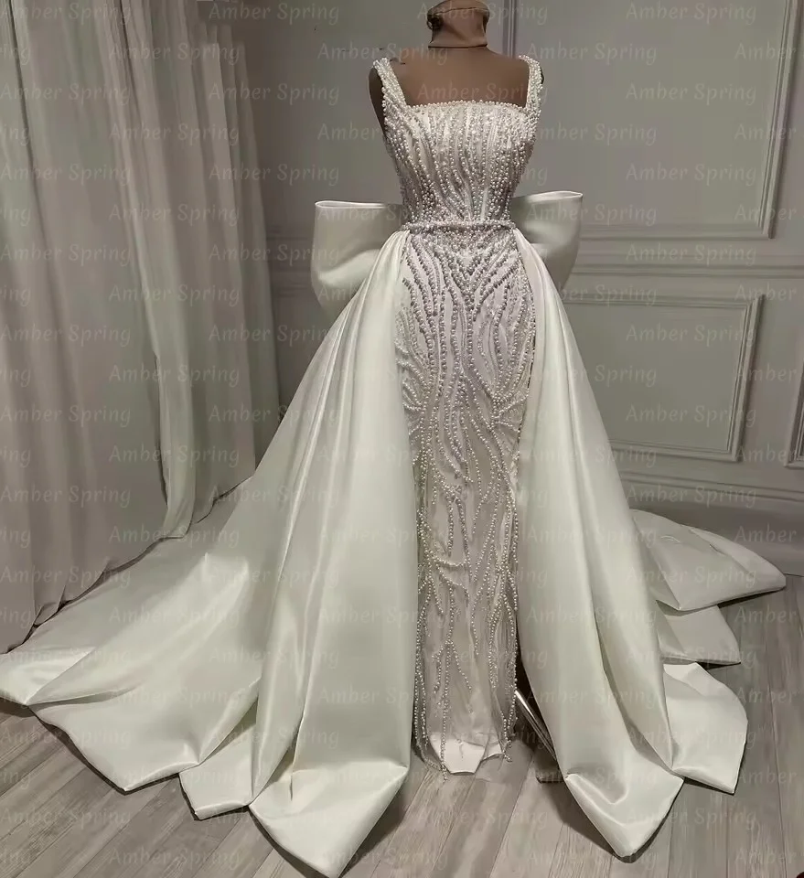 Customized Rich Pearls Wedding Dresses Sequins Neck Sequins Beads Formal Bridal Gowns With Satin Overskirt Big Bow Back Vestidos
Customized Rich Pearls Wedding Dresses Sequins Neck Sequins Beads Formal Bridal Gowns With Satin Overskirt Big Bow Back Vestidos