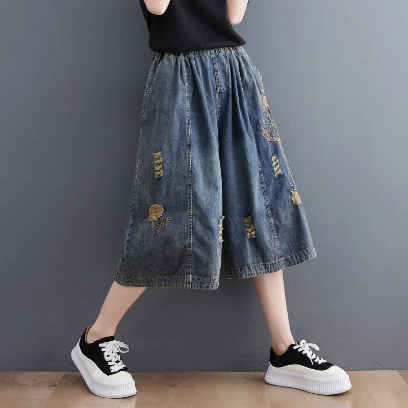 2026 Summer Women's Denim Wide Leg Pants Loose Slim Fit Elastic Waist Embroidered Ripped Capris Casual Streetwear
2026 Summer Women's Denim Wide Leg Pants Loose Slim Fit Elastic Waist Embroidered Ripped Capris Casual Streetwear
