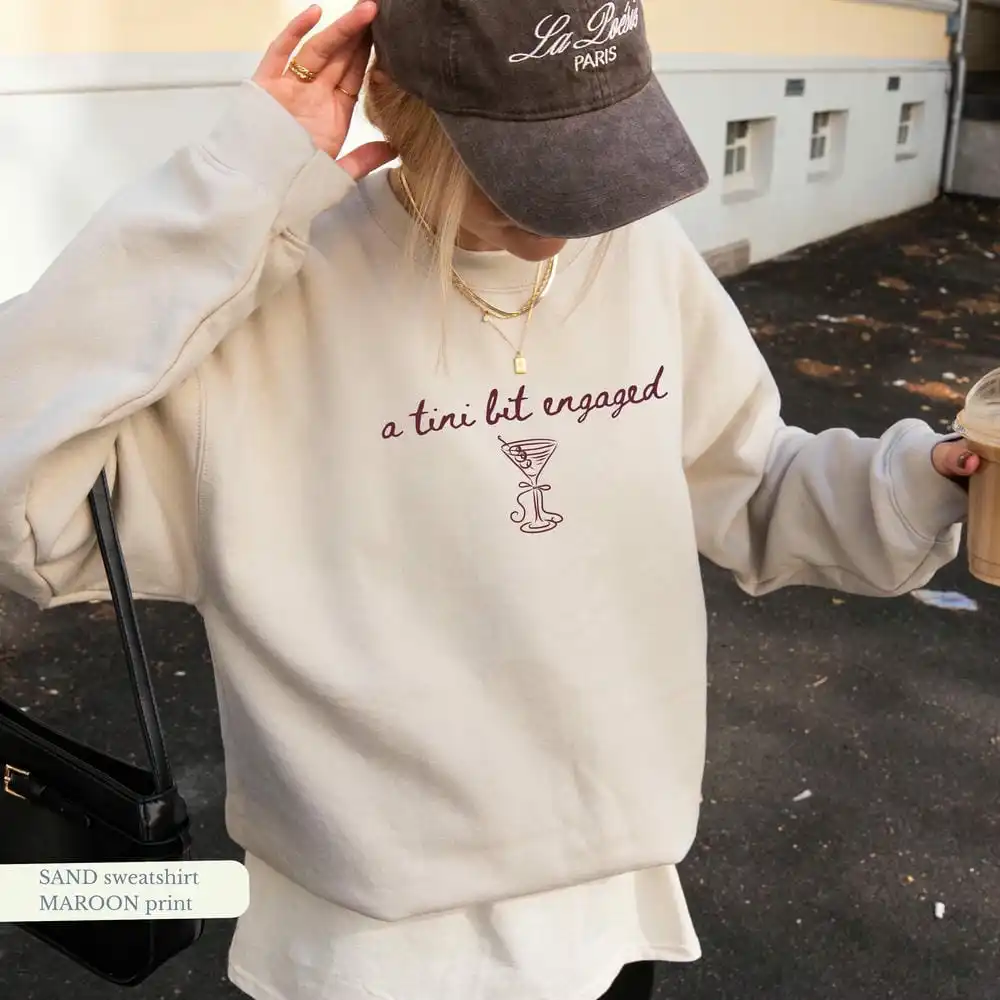 A Tini Bit Engaged Crewneck Bride-To-Be Tee Future Mrs. Sweatshirt Engagement Funny Unisex Top Daily Trendy Party Streetwear
A Tini Bit Engaged Crewneck Bride-To-Be Tee Future Mrs. Sweatshirt Engagement Funny Unisex Top Daily Trendy Party Streetwear