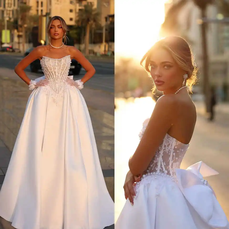 Simple A Line Wedding Dresses Pearls Lace Strapless Bride Dress Sleeveless Bow Sweep Train Princess Bridal Dress Customized
Simple A Line Wedding Dresses Pearls Lace Strapless Bride Dress Sleeveless Bow Sweep Train Princess Bridal Dress Customized