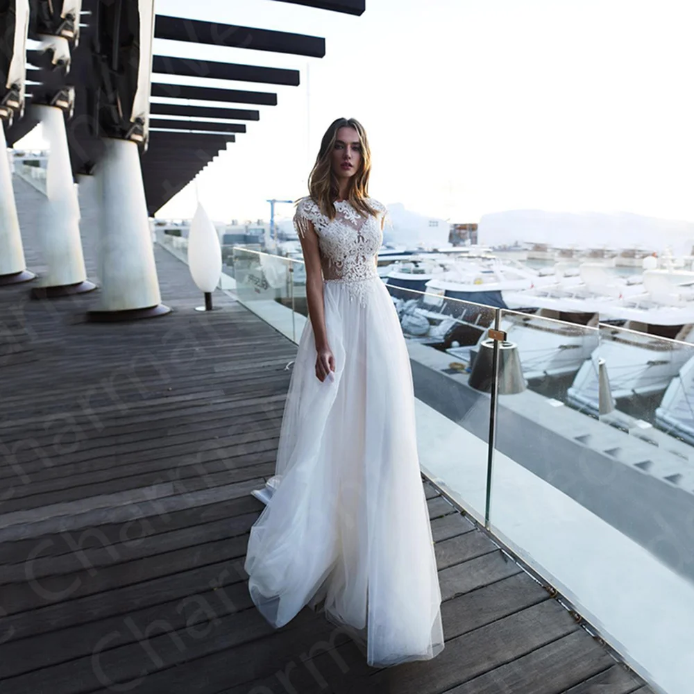 2023 New Boho Wedding Dresses Lace Beach Bridal Gowns White Cap Sleeves Backless Pearls Robe de mariée Sweep Train
2023 New Boho Wedding Dresses Lace Beach Bridal Gowns White Cap Sleeves Backless Pearls Robe de mariée Sweep Train