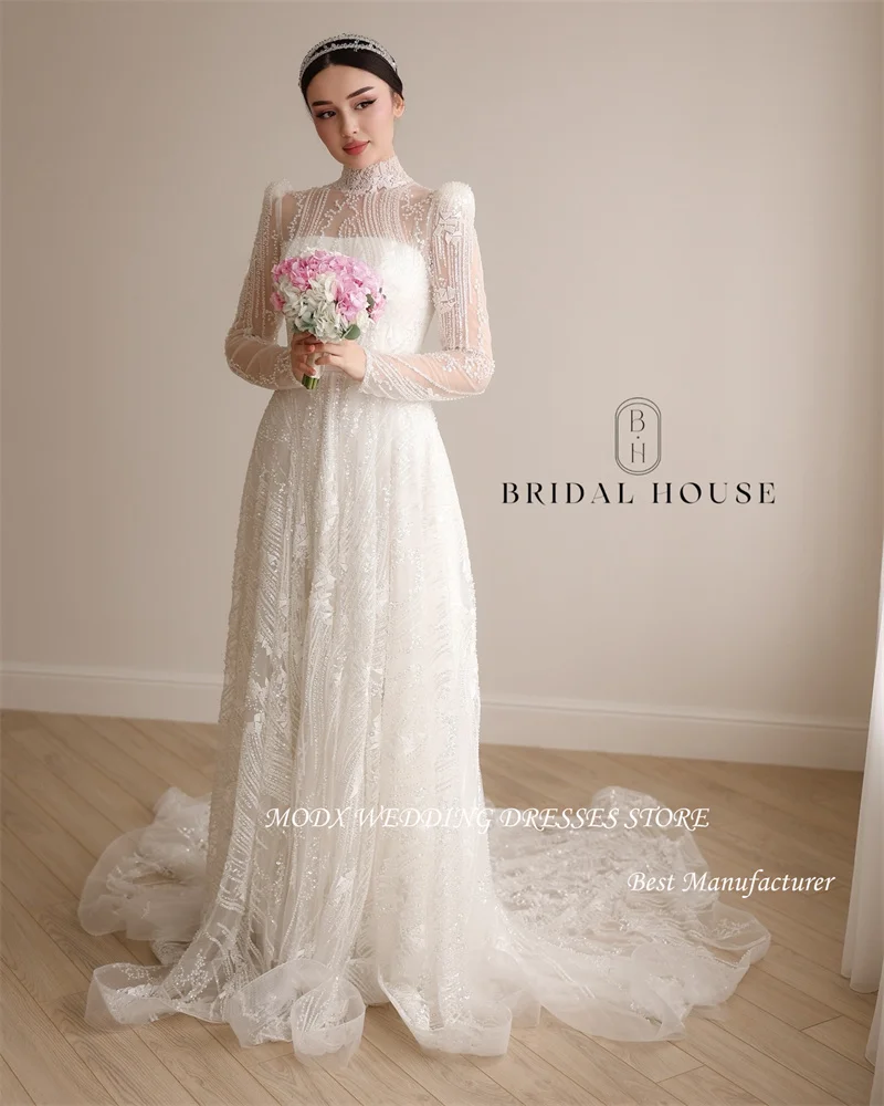 MODX Modest High Neck Full Lace Shiny Wedding Dresses Long Sleeves Sweep Train Dubai Arabic Women Bridal Gowns Robe de mariage
MODX Modest High Neck Full Lace Shiny Wedding Dresses Long Sleeves Sweep Train Dubai Arabic Women Bridal Gowns Robe de mariage