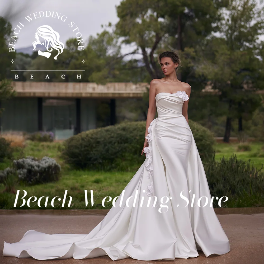 Пляжное без бретелек без рукавов Русалка с открытой спиной и съемным шлейфом Простое элегантное свадебное платье 2025 3D цветочное свадебное платье по индивидуальному заказу
Пляжное без бретелек без рукавов Русалка с открытой спиной и съемным шлейфом Простое элегантное свадебное платье 2025 3D цветочное свадебное платье по индивидуальному заказу