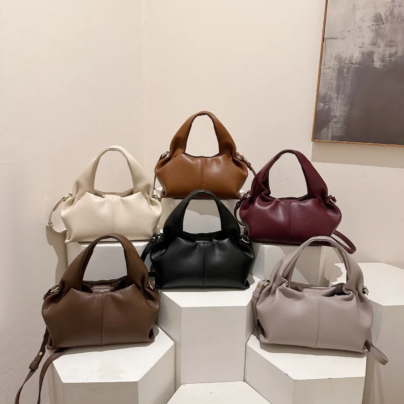 Handbag woman 2026 new one-shoulder crossbody dumpling bag high-end hand carrying cloud lunch box bag woman
Handbag woman 2026 new one-shoulder crossbody dumpling bag high-end hand carrying cloud lunch box bag woman
