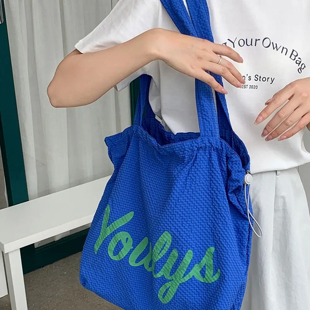 Canvas Drawstring Tote Bag Korean Style Shopping Bag Nylon Shoulder Bag Beach Bag Large Capacity Letter Printed Handbag Girls
Canvas Drawstring Tote Bag Korean Style Shopping Bag Nylon Shoulder Bag Beach Bag Large Capacity Letter Printed Handbag Girls