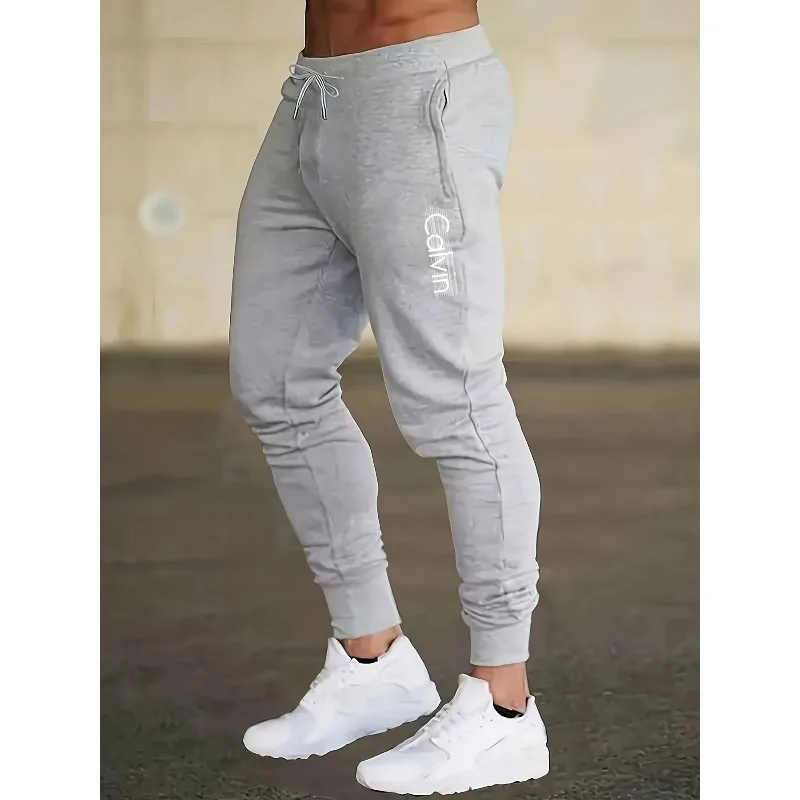 Men's casual sports pants with drawstring, "letter print, slightly elastic, suitable for loose pants in spring and autumn
Men's casual sports pants with drawstring, "letter print, slightly elastic, suitable for loose pants in spring and autumn
