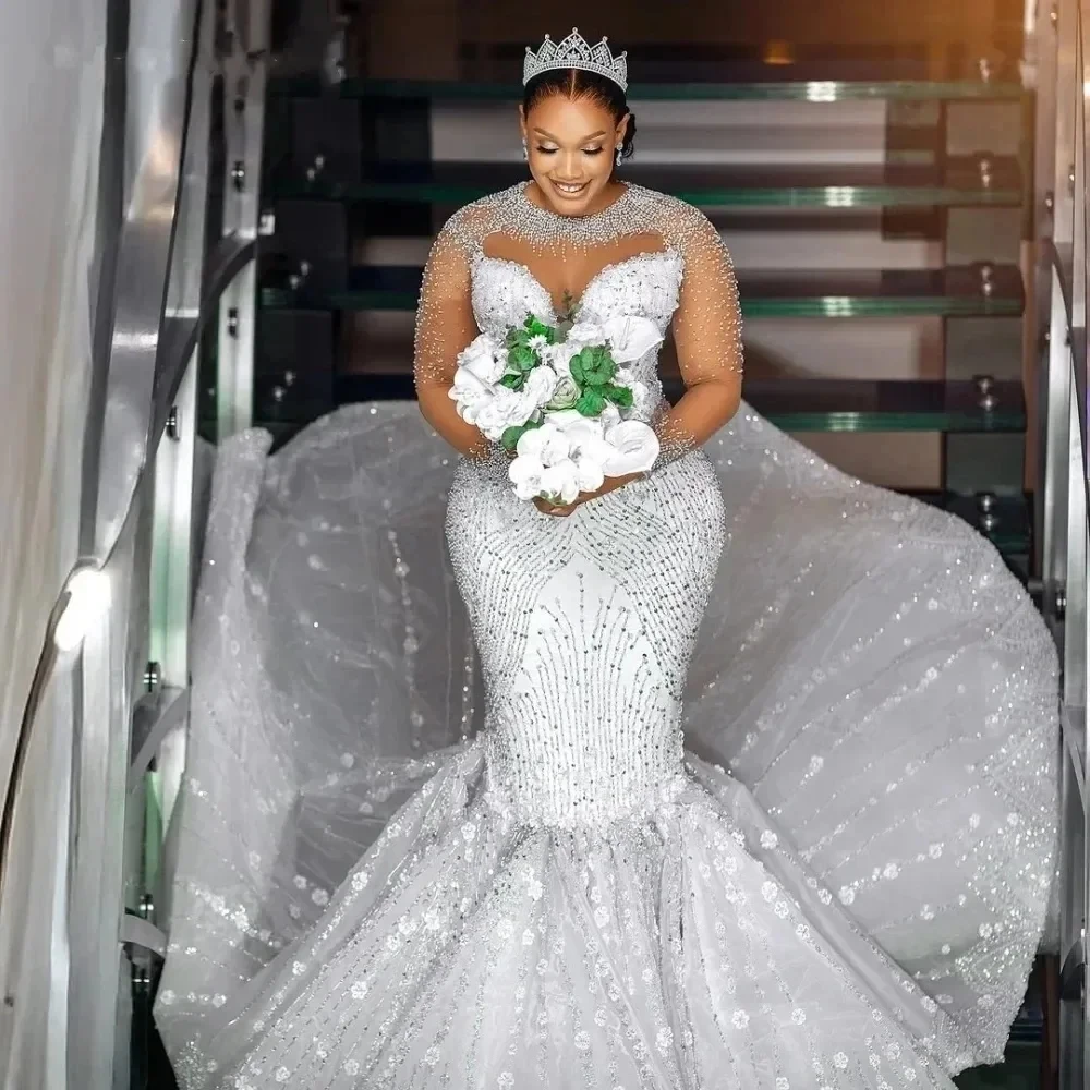 Luxury African Mermaid Wedding Dress 2026 O-neck Illusion Long Sleeves Beads Bridal Bride Grown Arabic Vestidos De Noiva
Luxury African Mermaid Wedding Dress 2026 O-neck Illusion Long Sleeves Beads Bridal Bride Grown Arabic Vestidos De Noiva