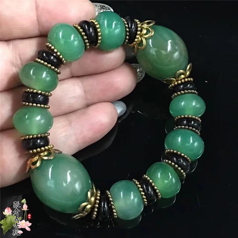 Xizang old jade agate three nine eye beads hand string bracelet male and female Buddha bucket bead sculpture
Xizang old jade agate three nine eye beads hand string bracelet male and female Buddha bucket bead sculpture