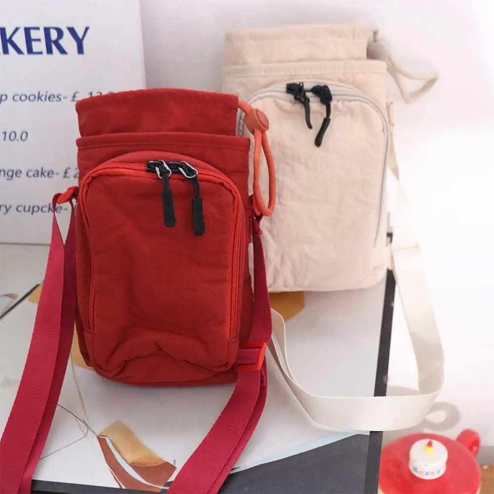 Canvas Shoulder Water Bottle Bag Solid Color Drawstring Crossbody Mobile Phone Bag Korean Style Minimalist Water Cup Bag
Canvas Shoulder Water Bottle Bag Solid Color Drawstring Crossbody Mobile Phone Bag Korean Style Minimalist Water Cup Bag