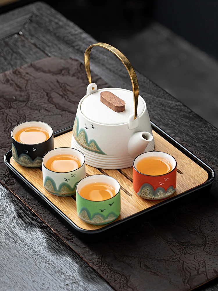 Japanese-style distant mountain travel kung fu tea set, one pot and four cups of simple filter teapot, portable bag, small set
Japanese-style distant mountain travel kung fu tea set, one pot and four cups of simple filter teapot, portable bag, small set