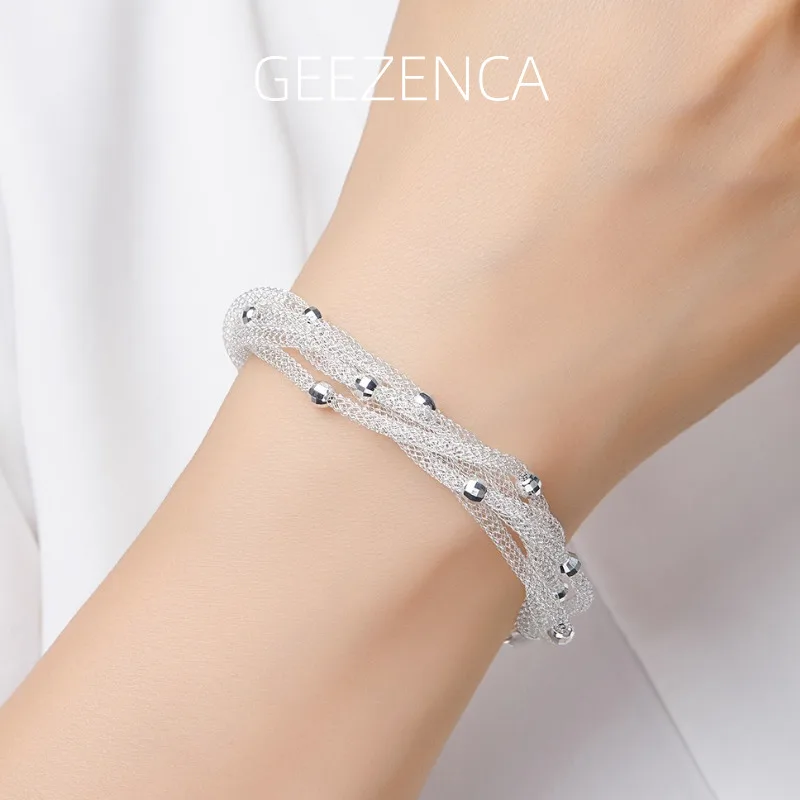 GEEZENCA, серебро 925 пробы, 5-слойные тканые 3D полые сетчатые браслеты-цепочки, женские итальянские украшения, 9,5 мм, модный изящный браслет, подарок для нее
GEEZENCA, серебро 925 пробы, 5-слойные тканые 3D полые сетчатые браслеты-цепочки, женские итальянские украшения, 9,5 мм, модный изящный браслет, подарок для нее