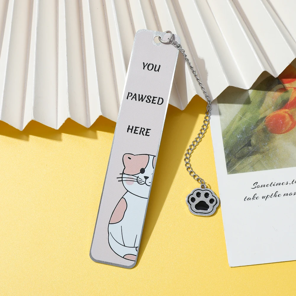 Cute Cat Metal Bookmark (with Claw Print Pendant) - "You Pawsed Here" Fun Design Cat Slave, Book Enthusiast, and Gift Preferred.
Cute Cat Metal Bookmark (with Claw Print Pendant) - "You Pawsed Here" Fun Design Cat Slave, Book Enthusiast, and Gift Preferred.