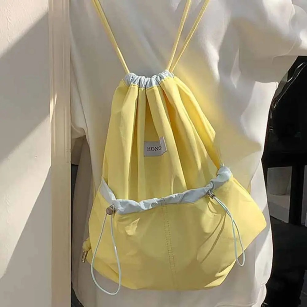 Korean Style Drawstring Backpacks Large Capacity Contrast Color Light Soft Nylon Bag Niche Design Solid Color Shoulder Bag
Korean Style Drawstring Backpacks Large Capacity Contrast Color Light Soft Nylon Bag Niche Design Solid Color Shoulder Bag
