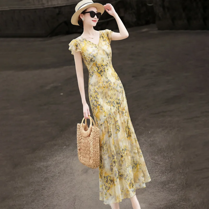 MEXCOCO 2026 New Summer French Elegant V Neck Ruffle Flutter Sleeve Printed Chiffon Mermaid Maxi Slim Beach Long Dress
MEXCOCO 2026 New Summer French Elegant V Neck Ruffle Flutter Sleeve Printed Chiffon Mermaid Maxi Slim Beach Long Dress