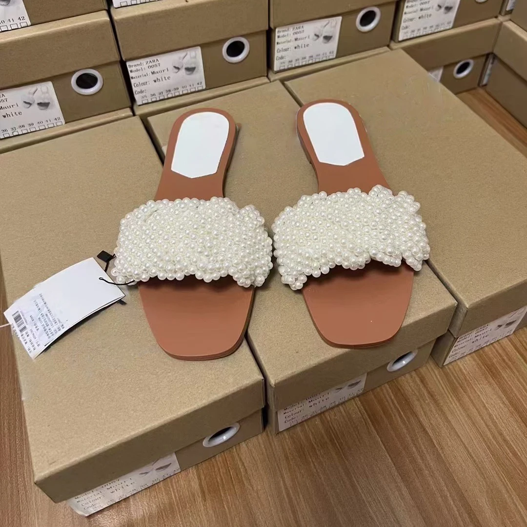 2026 Summer New Product Women's Shoes White Pearl Weaving Flat Sandals Outerwear Fashion Cool Slippers
2026 Summer New Product Women's Shoes White Pearl Weaving Flat Sandals Outerwear Fashion Cool Slippers