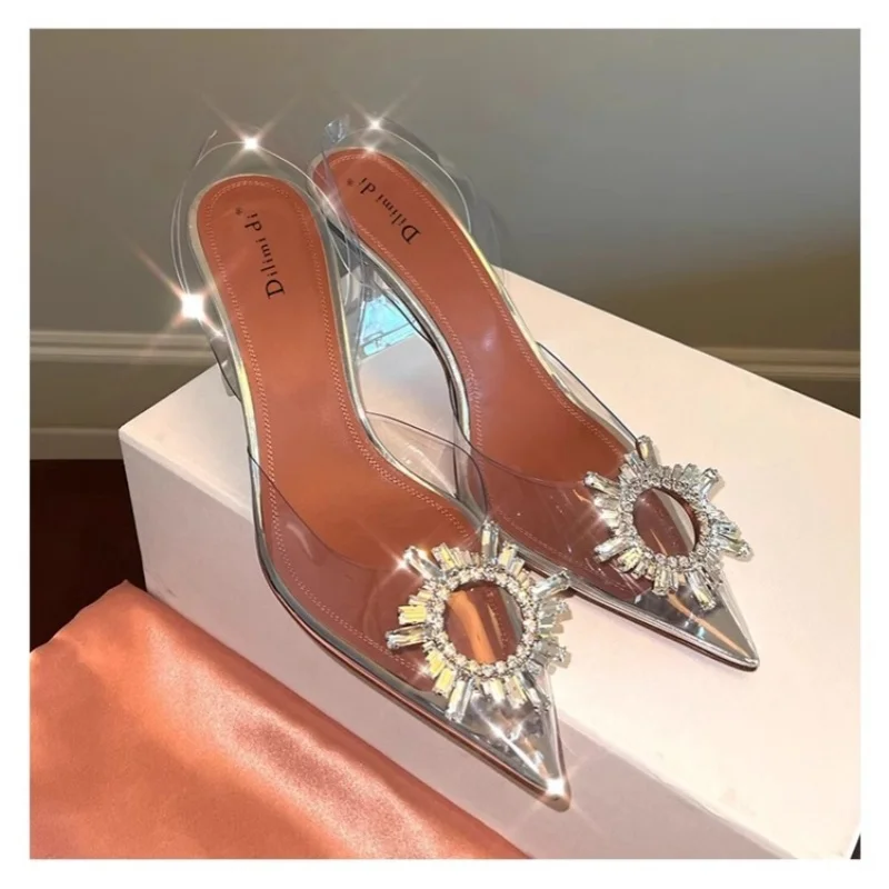 Summer new pointed rhinestone buckle transparent PVC sexy flat sandals thin high-heeled banquet dress versatile women's sandals
Summer new pointed rhinestone buckle transparent PVC sexy flat sandals thin high-heeled banquet dress versatile women's sandals