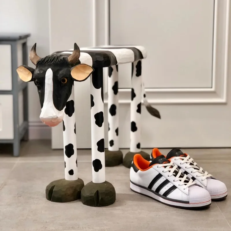 Solid wood hand-carved Nordic animal cow shoe stool home door creative entry low stool porch shoe stool
Solid wood hand-carved Nordic animal cow shoe stool home door creative entry low stool porch shoe stool