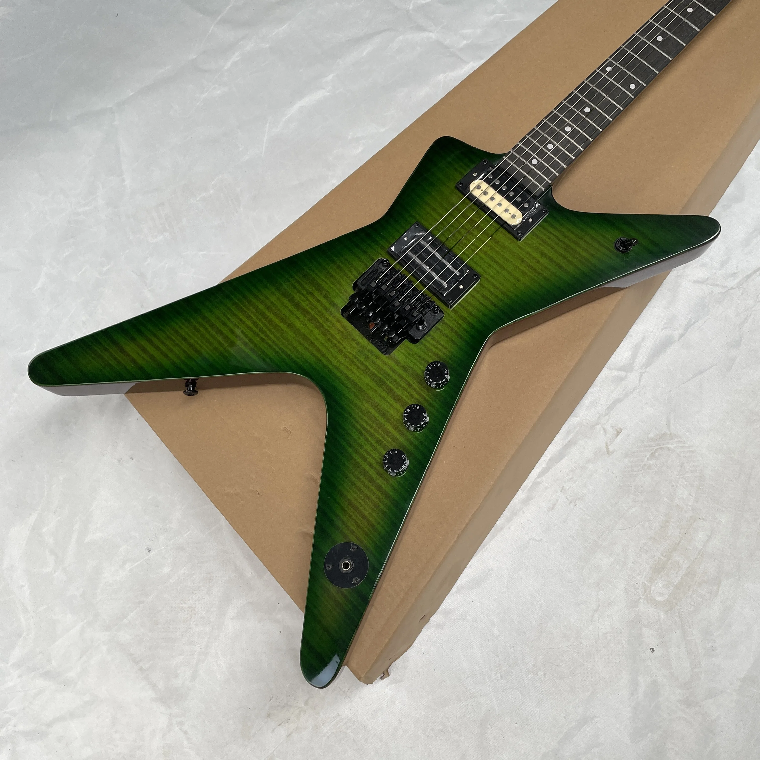 New green tiger print electric guitar, mahogany body, black double-locking tremolo guitars, advanced speed-picking guitarra
New green tiger print electric guitar, mahogany body, black double-locking tremolo guitars, advanced speed-picking guitarra