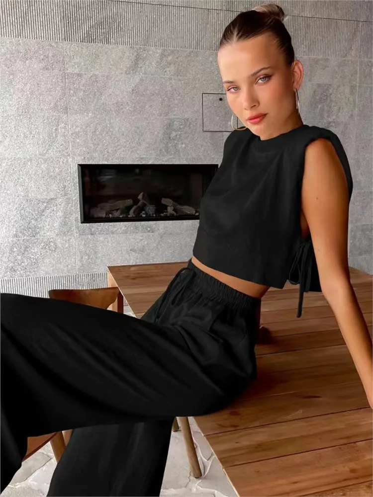 Fashionable Shoulder Pad Sleeveless Tops And Pants 2-piece Set 2026 Summer New Casual Solid Color Wide Leg Pants Women's Suit
Fashionable Shoulder Pad Sleeveless Tops And Pants 2-piece Set 2026 Summer New Casual Solid Color Wide Leg Pants Women's Suit