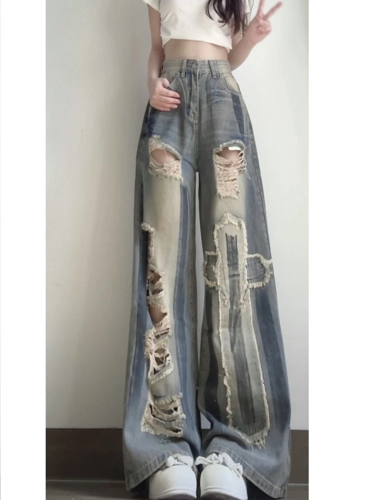 American style casual retro high waist loose ripped wide leg jeans women's trendy temperament street straight leg pants
American style casual retro high waist loose ripped wide leg jeans women's trendy temperament street straight leg pants