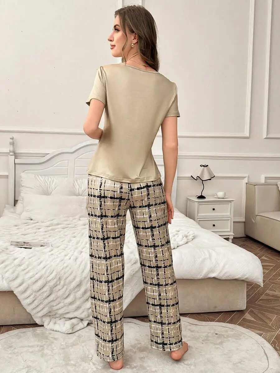 2-Piece Pajama Set: Solid Short Sleeve Top And Plaid Wide Leg Pants
2-Piece Pajama Set: Solid Short Sleeve Top And Plaid Wide Leg Pants