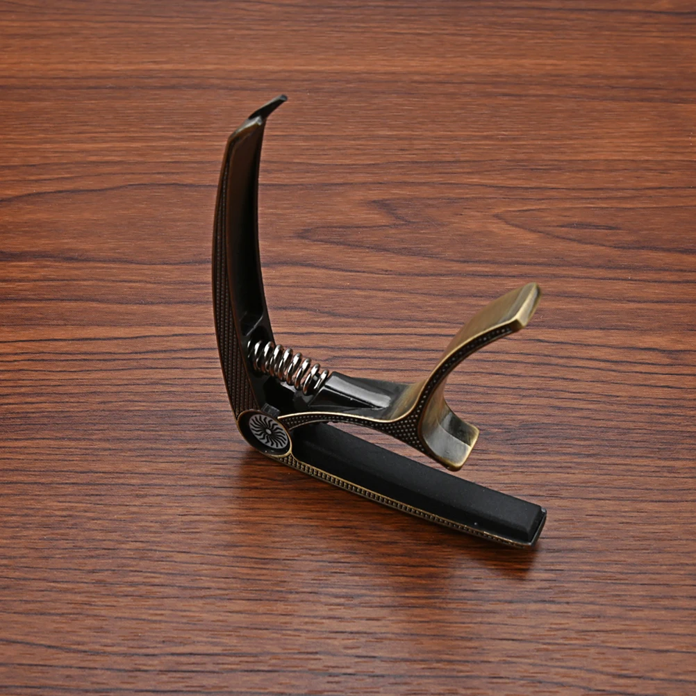 Metal Guitar Capo Tone Modified Clip Brown Portable Durable Elastic Spring Stable Pressure Practical Guitar Parts Accessories
Metal Guitar Capo Tone Modified Clip Brown Portable Durable Elastic Spring Stable Pressure Practical Guitar Parts Accessories