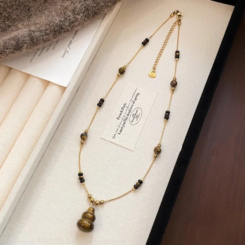 New Chinese Titanium Steel Gold Wire Chain Autumn and Winter Merad Tiger's Eye Stone Gourd Pendant Necklace Women's Long Tempera
New Chinese Titanium Steel Gold Wire Chain Autumn and Winter Merad Tiger's Eye Stone Gourd Pendant Necklace Women's Long Tempera