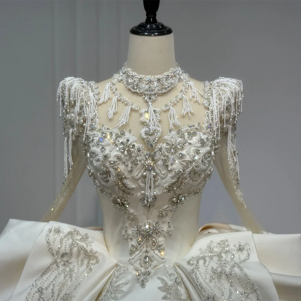 2026 Bridal Dress With Long Sleeves Lace-Up Keyhole Back Beading & Crystal Detail Customizable Turtle Neck Gown For Weddings
2026 Bridal Dress With Long Sleeves Lace-Up Keyhole Back Beading & Crystal Detail Customizable Turtle Neck Gown For Weddings