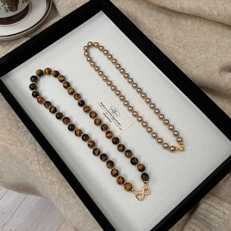 Micro-inlaid Buckle Can Be Split, Autumn and Winter Merad, Tiger's Eye Stone, Gold-brown Shijia Pearl Double-layer Necklace, Swe
Micro-inlaid Buckle Can Be Split, Autumn and Winter Merad, Tiger's Eye Stone, Gold-brown Shijia Pearl Double-layer Necklace, Swe
