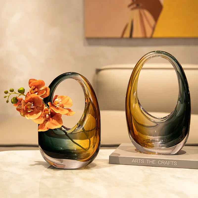 Light luxury colorful glass handbag, glazed flower arrangement, home decoration ornament, sample room, color art vase.
Light luxury colorful glass handbag, glazed flower arrangement, home decoration ornament, sample room, color art vase.