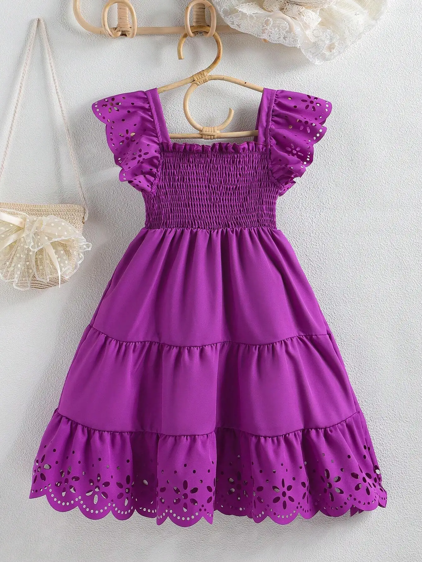 Purple Solid Shirred Dress With Eyelet Ruffle Sleeve And Hem
Purple Solid Shirred Dress With Eyelet Ruffle Sleeve And Hem
