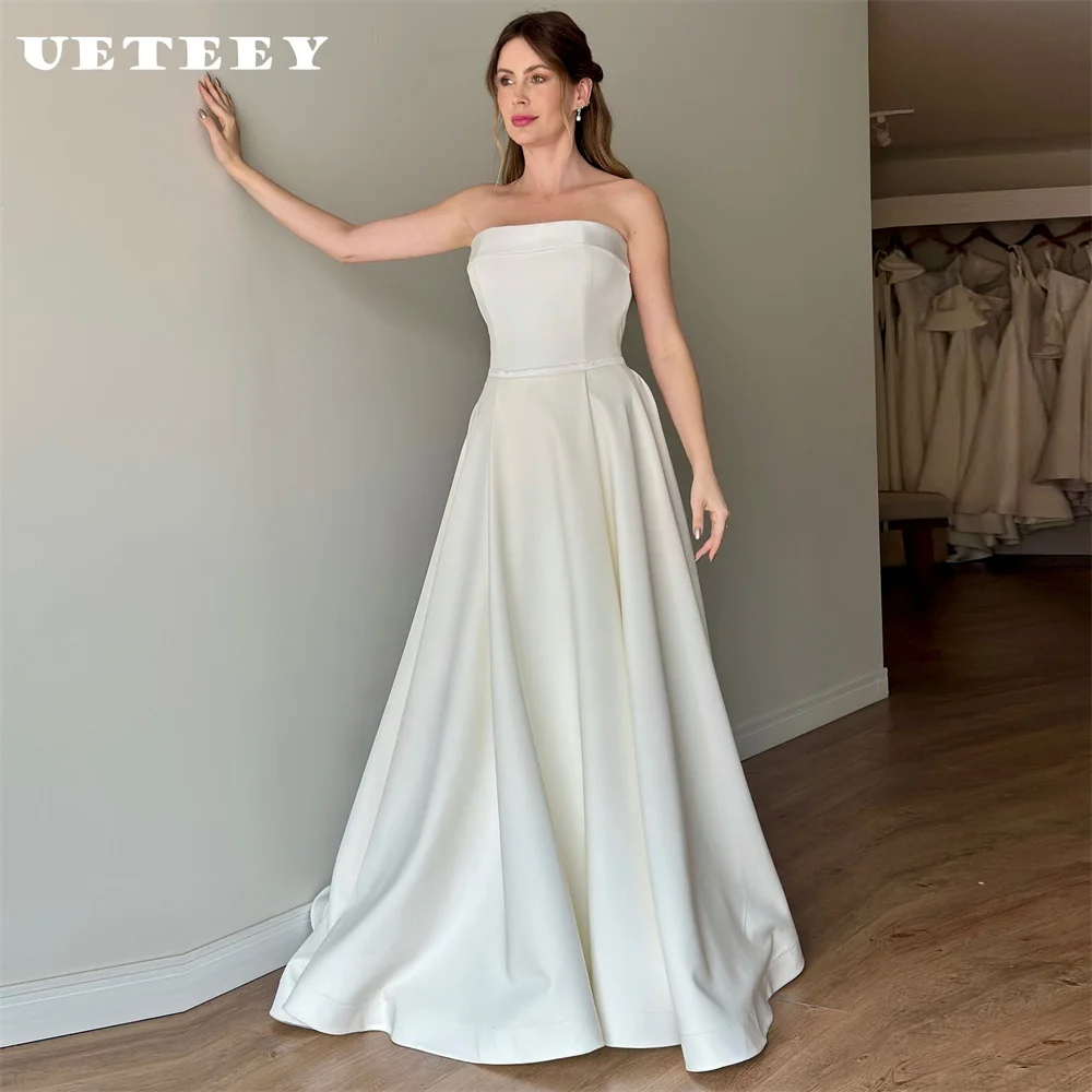 UETEEY Customized Simple Cut Out Strapless Wedding Dress Women Elegant Crepe Bow A Line Open Back Floor Length Bridal Gown
UETEEY Customized Simple Cut Out Strapless Wedding Dress Women Elegant Crepe Bow A Line Open Back Floor Length Bridal Gown