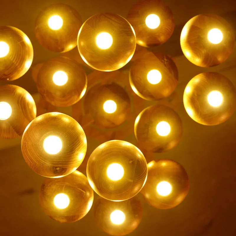 In the Nordic art creative personality hotel living room lighting log wood ball LED simple restaurant chandelier
In the Nordic art creative personality hotel living room lighting log wood ball LED simple restaurant chandelier