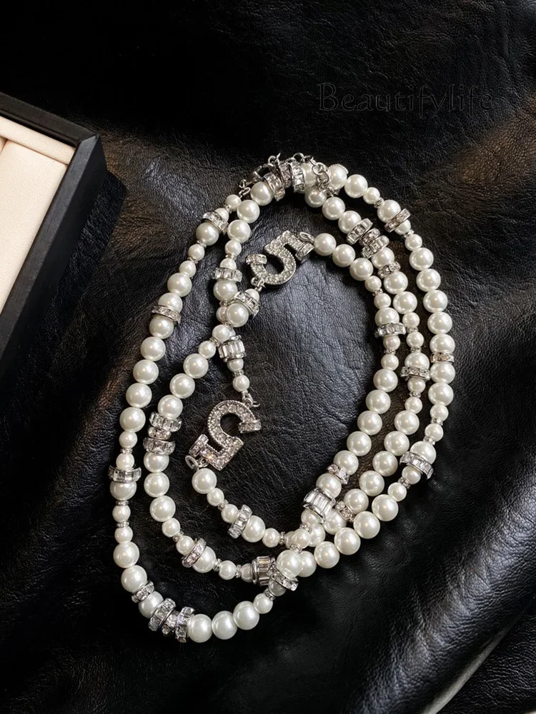 Zircon number 5 pearl necklace women's long light luxury high-end autumn and winter new sweater chain
Zircon number 5 pearl necklace women's long light luxury high-end autumn and winter new sweater chain