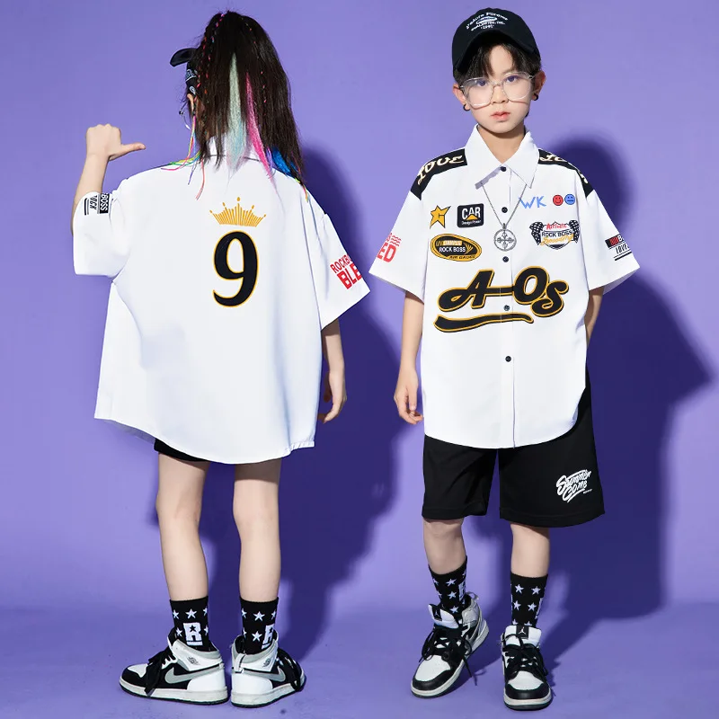 Детская одежда в стиле хип-хоп, белая гоночная рубашка большого размера с принтом, черные повседневные летние шорты для девочек и мальчиков, костюм для джазовых танцев, одежда
Детская одежда в стиле хип-хоп, белая гоночная рубашка большого размера с принтом, черные повседневные летние шорты для девочек и мальчиков, костюм для джазовых танцев, одежда