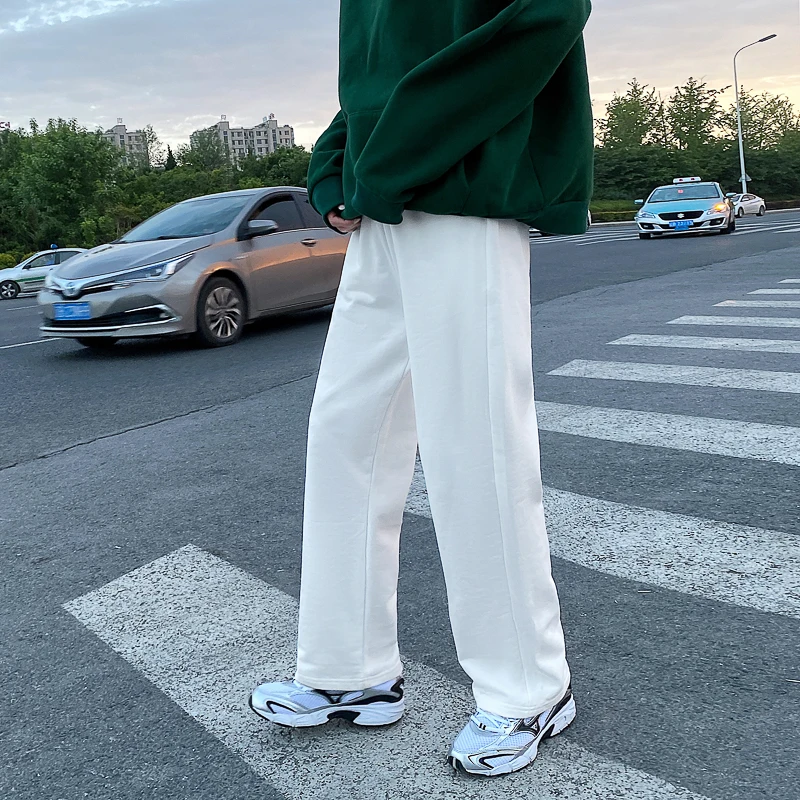 Летние белые спортивные брюки, мужские Модные прямые повседневные брюки, Мужская Уличная одежда, свободные бриллиантовые брюки в Корейском стиле
Летние белые спортивные брюки, мужские Модные прямые повседневные брюки, Мужская Уличная одежда, свободные бриллиантовые брюки в Корейском стиле