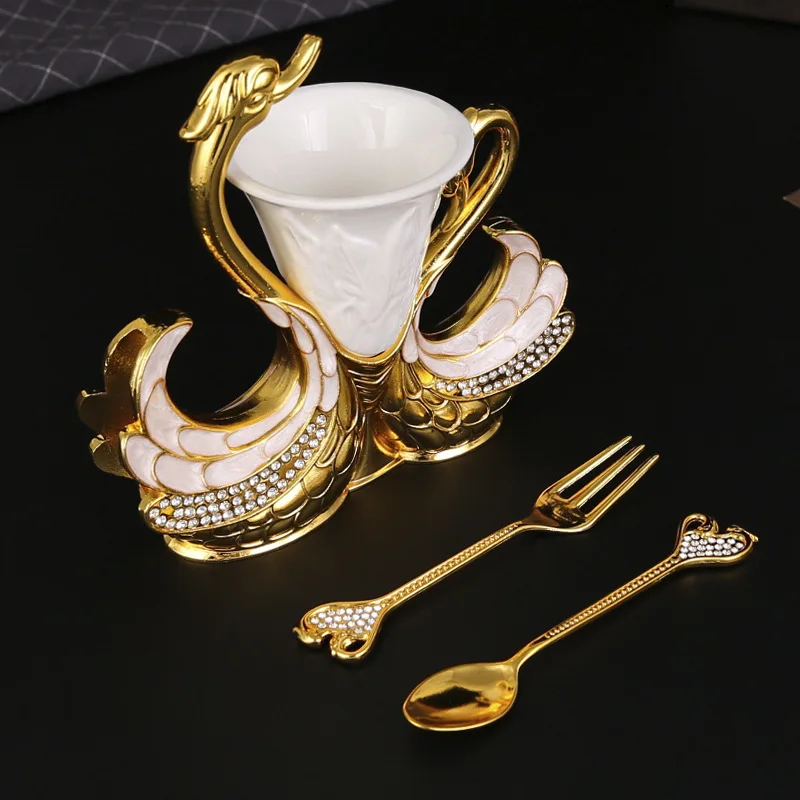 A Set of Swan Shaped Fruit Forks and Spoons, with A Bucket Rack Containing 6 Spoons or Forks
A Set of Swan Shaped Fruit Forks and Spoons, with A Bucket Rack Containing 6 Spoons or Forks