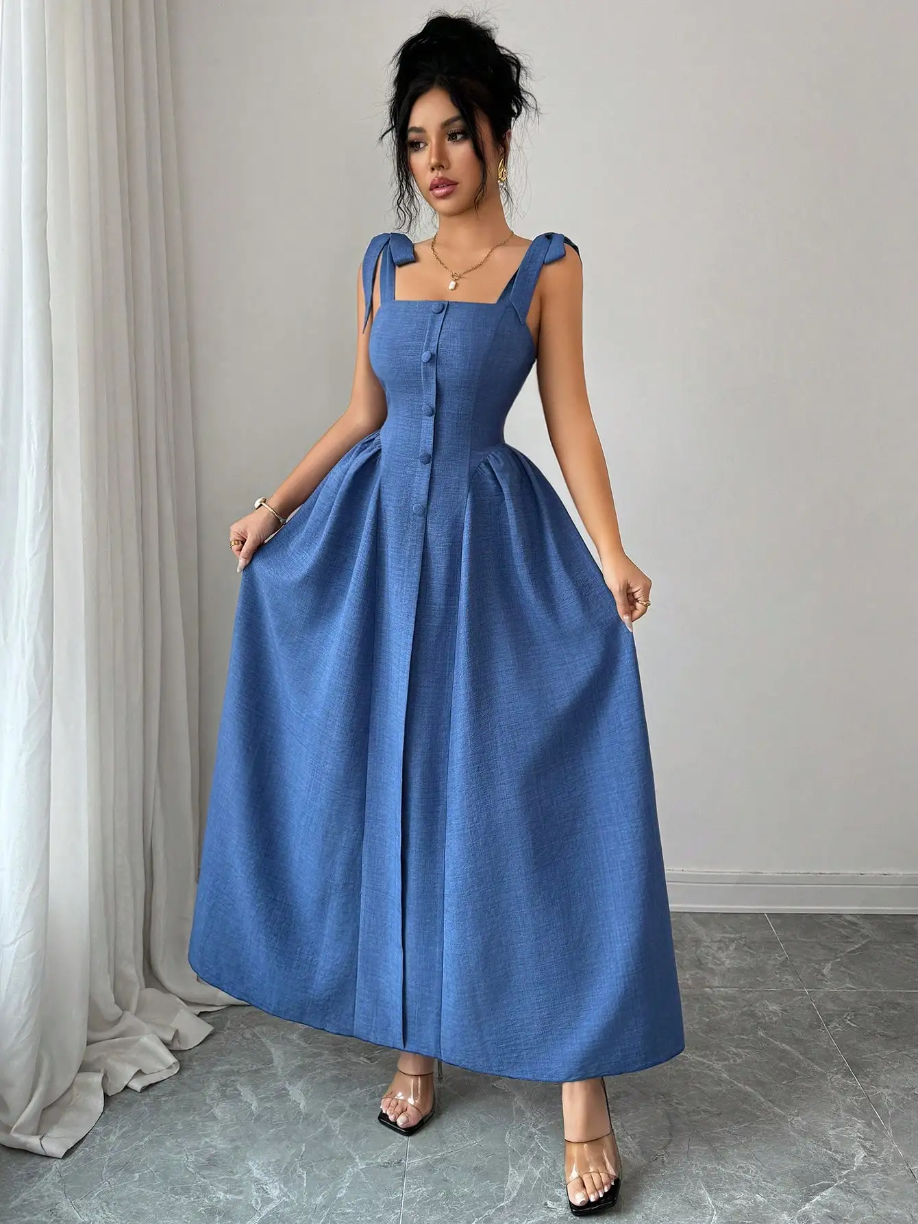 Elegant Blue A-Line Long Dress With Bow Straps And Button Front
Elegant Blue A-Line Long Dress With Bow Straps And Button Front