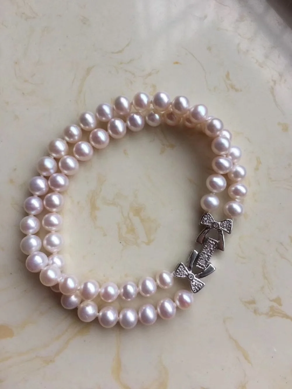 Браслет из натурального жемчуга AAAA 5-6 мм, двойной ряд, с застежкой-бабочкой из серебра 925 пробы, 7,5-8 дюймов
Браслет из натурального жемчуга AAAA 5-6 мм, двойной ряд, с застежкой-бабочкой из серебра 925 пробы, 7,5-8 дюймов