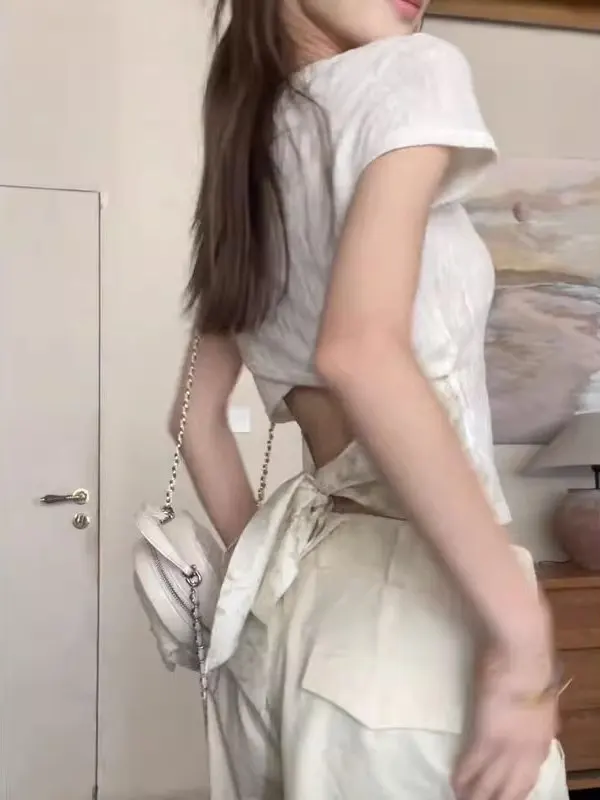 American Sle ort Sve T-irt Women Summer Slimming Sexy Ba Hollow out Belt Design Unique Top round Ne ort Length
American Sle ort Sve T-irt Women Summer Slimming Sexy Ba Hollow out Belt Design Unique Top round Ne ort Length